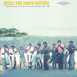 Ten men playing in the village plaza