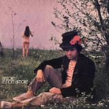 Seduto sotto un platano con una margherita in bocca guardando il fiume nero macchiato dalla schiuma bianca dei detersivi